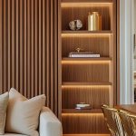 A trendy slat wall design helps divide open rooms in a subtle yet effective way_